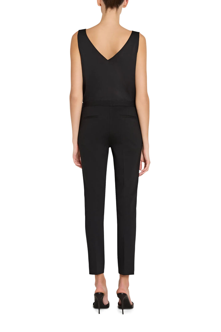 Slim, ankle-length cigarette knit pant with tailored seams and flat waistband; back view on model.