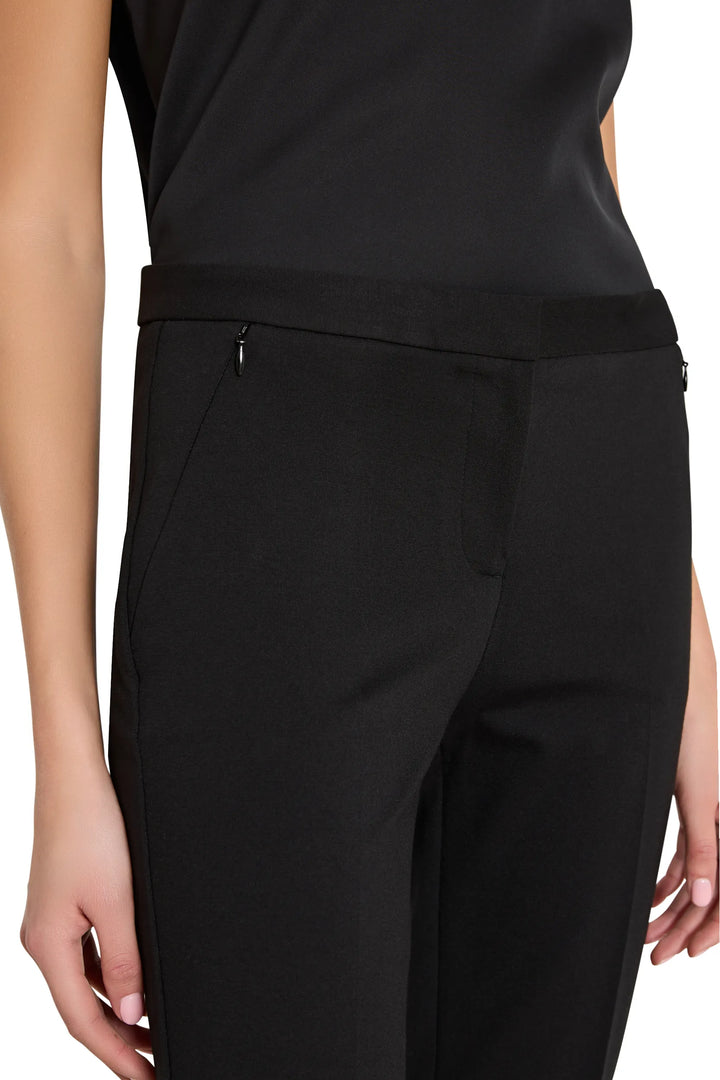 Slim cigarette silhouette pant in stretch knit fabric, tailored fit with flat front. Front view on model.