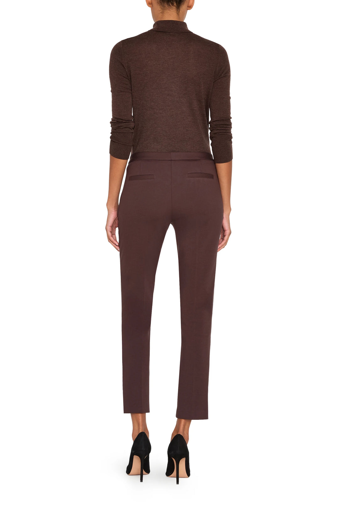 Slim, ankle-length knit pant with front zip pockets and tailored silhouette, front view on model.