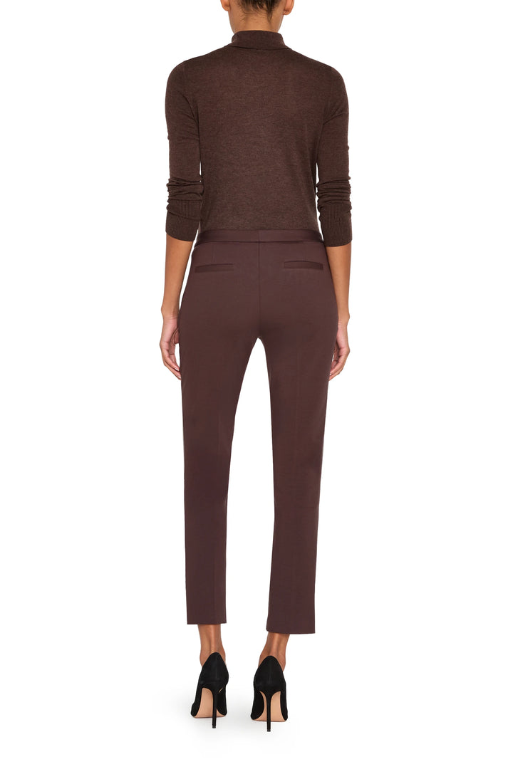 Slim, ankle-length knit pant with front zip pockets and tailored silhouette, front view on model.