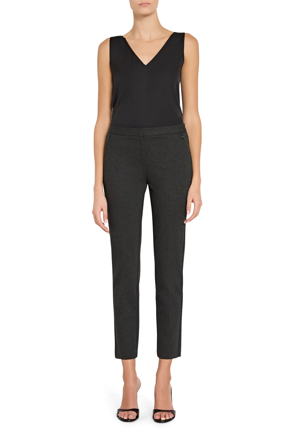 Slim, tailored cigarette pant with front zip pockets and fitted ankle, in knit fabric; front view on model.