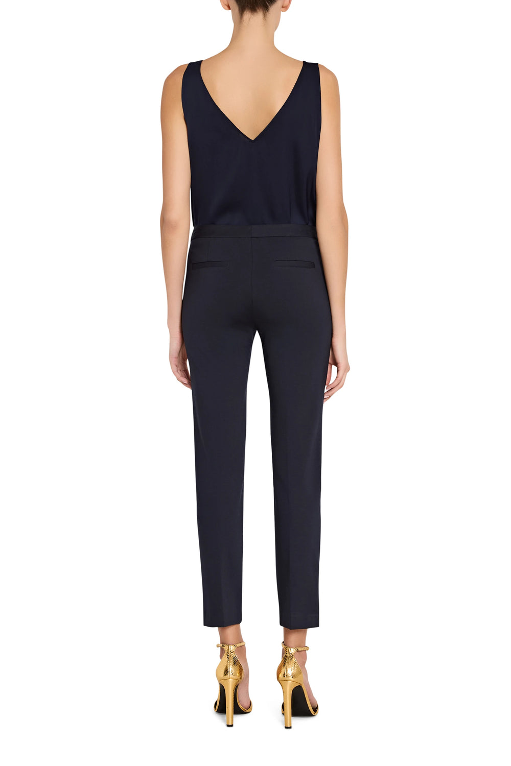 Straight-leg silhouette, tailored waistband, knit fabric, full-length hem. Back view on model.