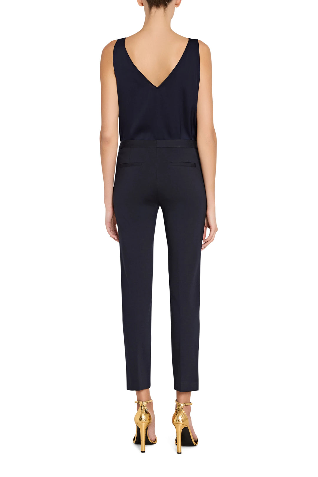 Straight-leg silhouette, tailored waistband, knit fabric, full-length hem. Back view on model.