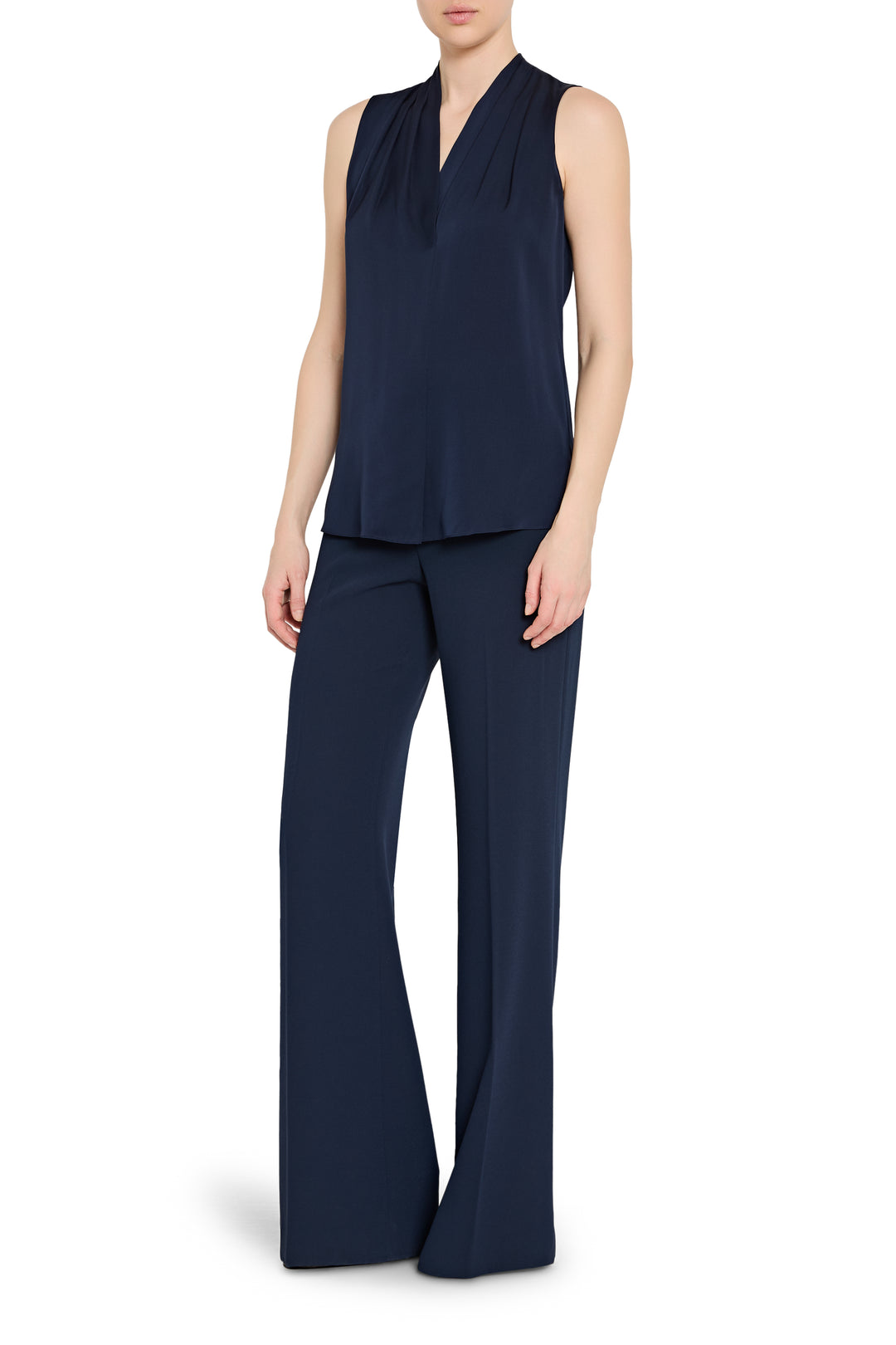 Navy blue sleeveless top and pants set on a white background