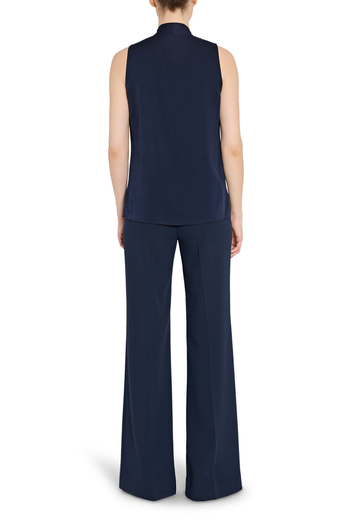 Navy sleeveless top and wide-leg pants on a white background