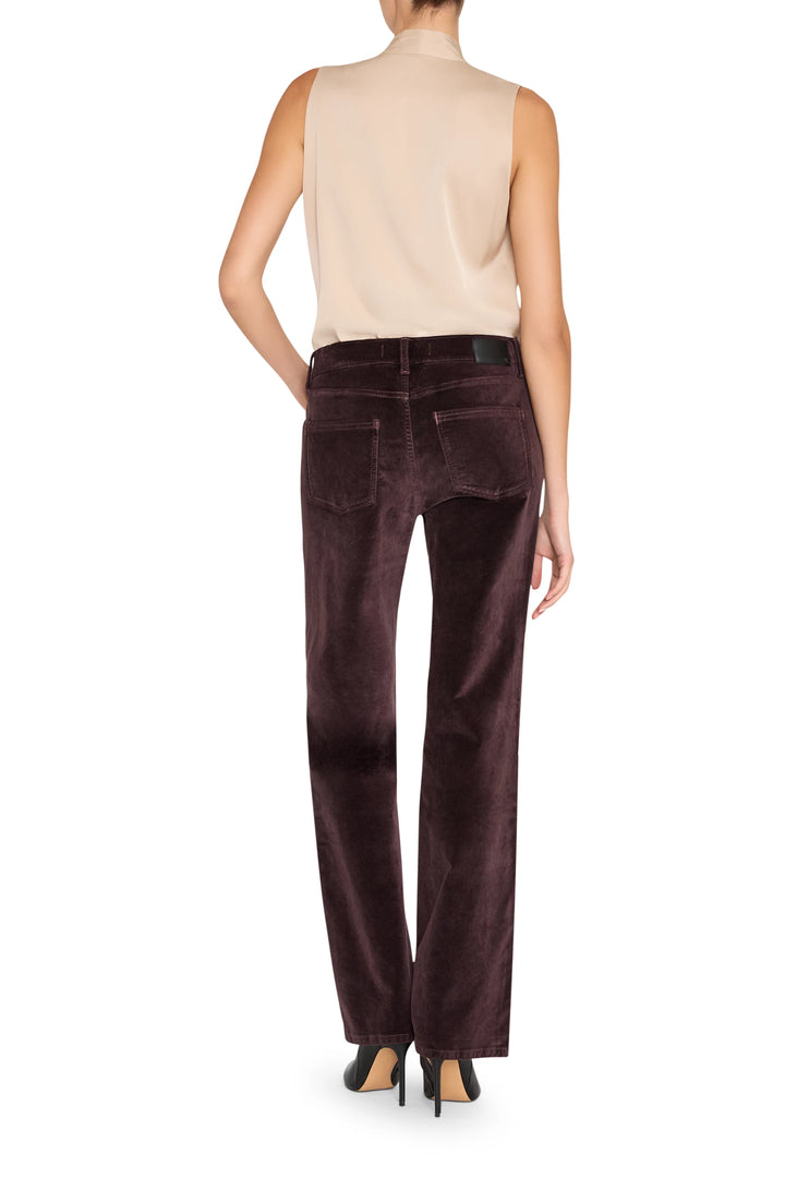 Sleeveless silk blouse with fluid drape and clean lines, back view on model.