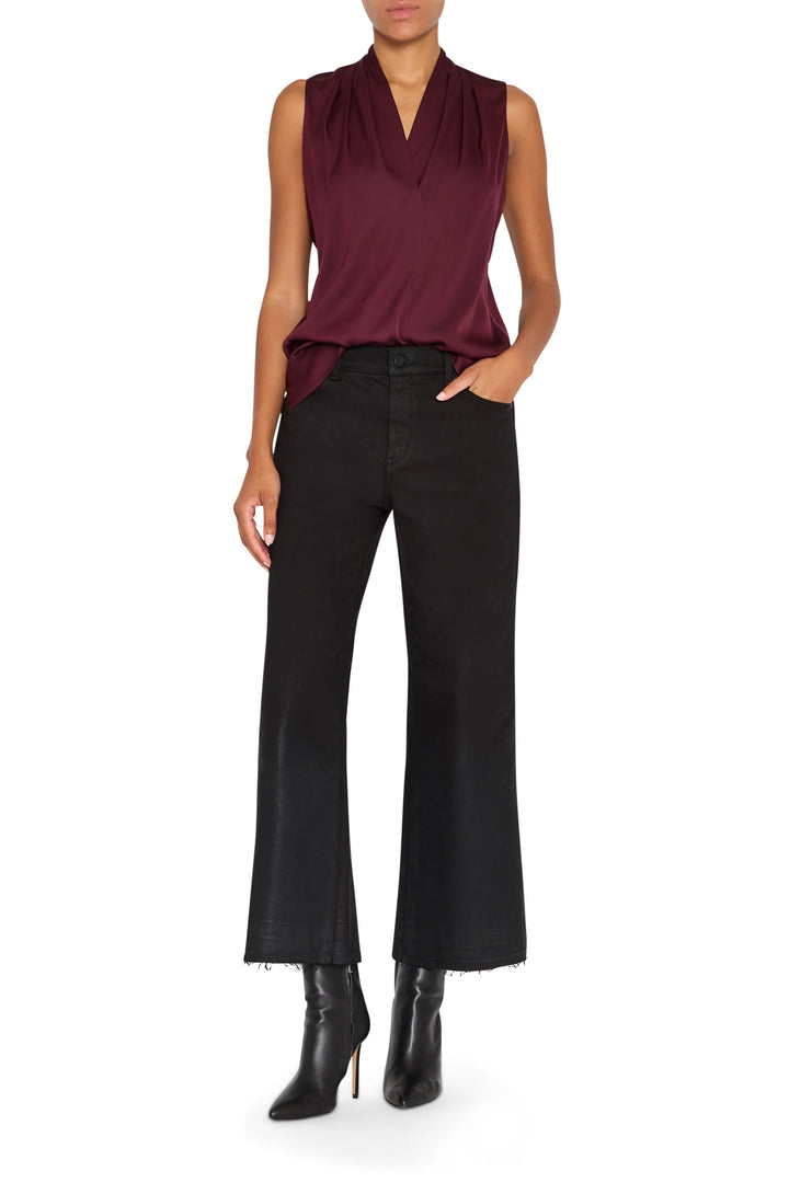 Silk blouse with relaxed silhouette, subtle drape and classic collar; front view on model.