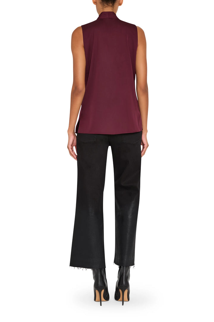 Burgundy silk blouse with relaxed fit, long sleeves, and classic shirt collar; back view on model.