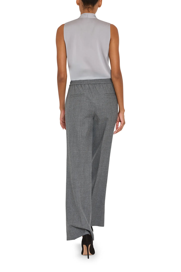 Relaxed-fit Mila Silk Blouse with fluid drape and clean lines, back view on model.