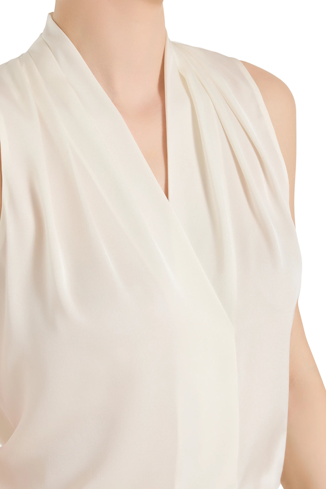 Cream-colored sleeveless top on a mannequin with a plain background