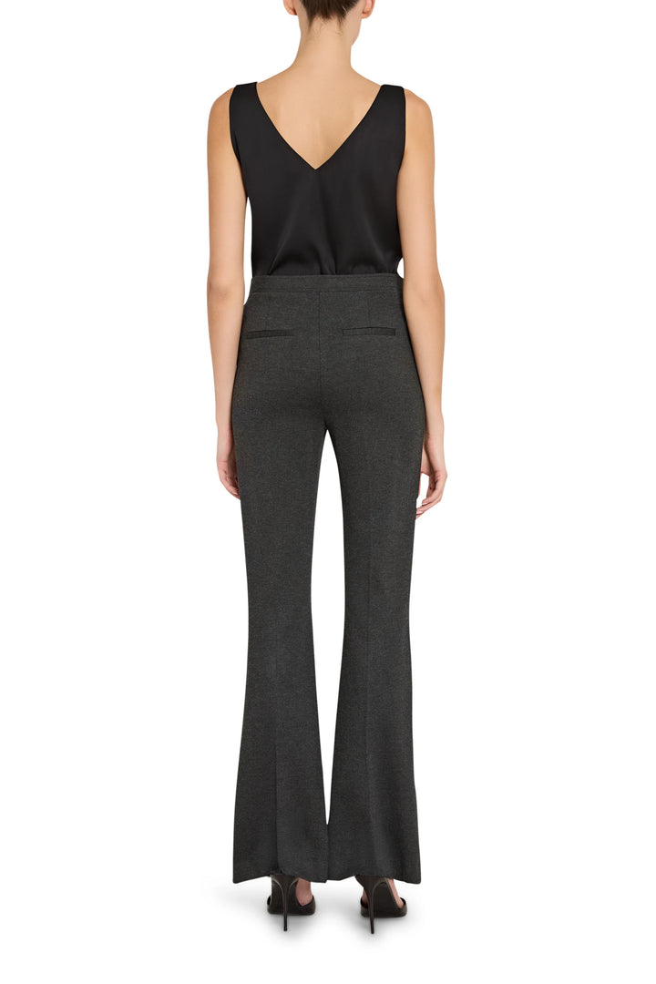 Wide-leg silhouette with elastic waistband and soft knit fabric, full-length. Back view on model.