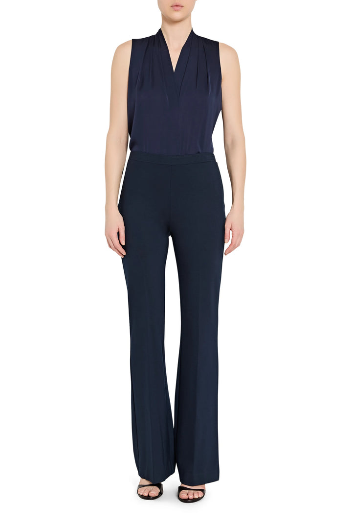 High-waist, pull-on pant with straight silhouette and smooth finish in navy knit; front view on model.
