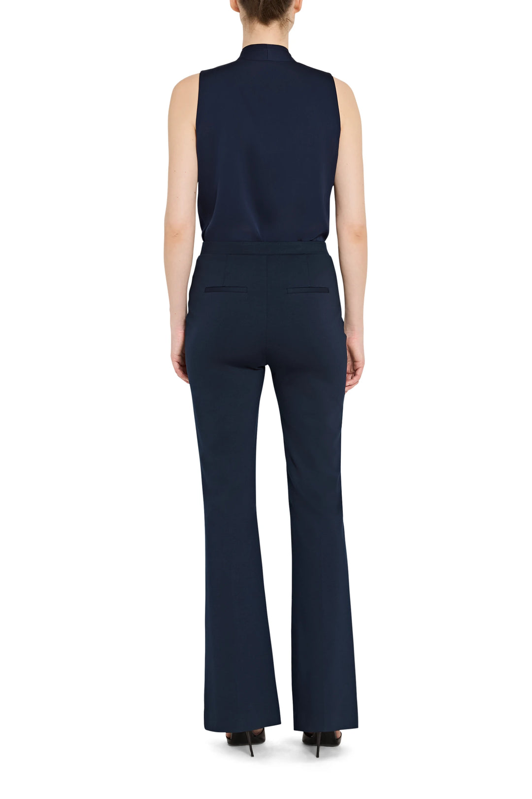 Fluid, wide-leg silhouette pant in soft knit fabric with elastic waistband; back view on model.