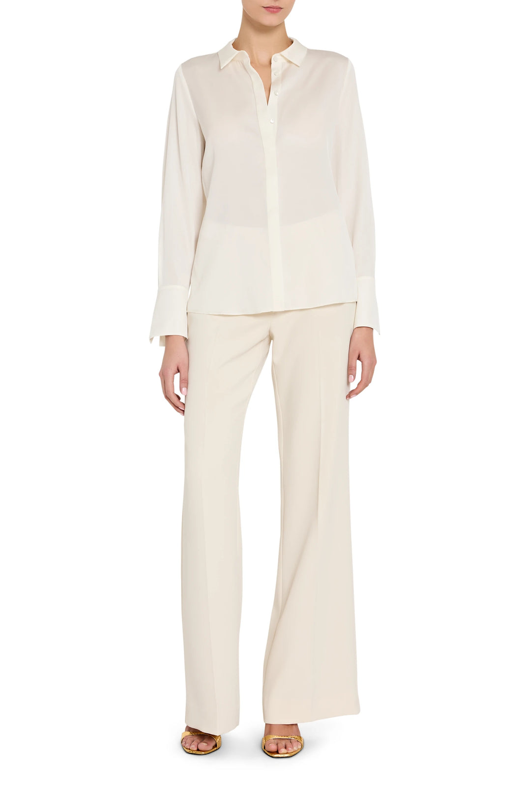 Woman wearing a white shirt and pants on a white background