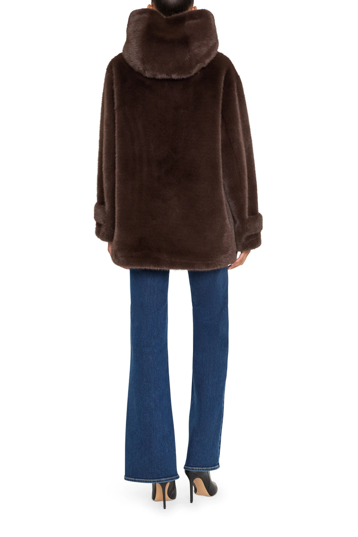 Rosie Faux Fur Coat with plush silhouette and dense faux fur texture, hem at hip. Back view on model.