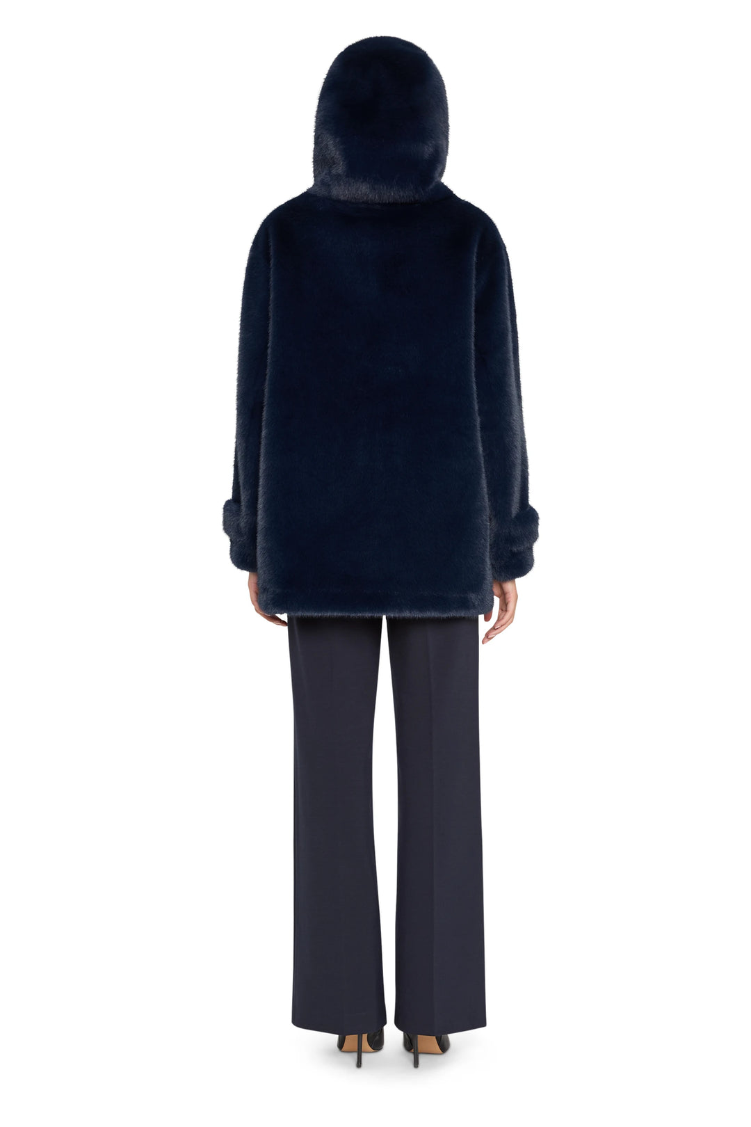 Longline faux fur coat with relaxed silhouette and stand collar, textured finish. Back view on white.