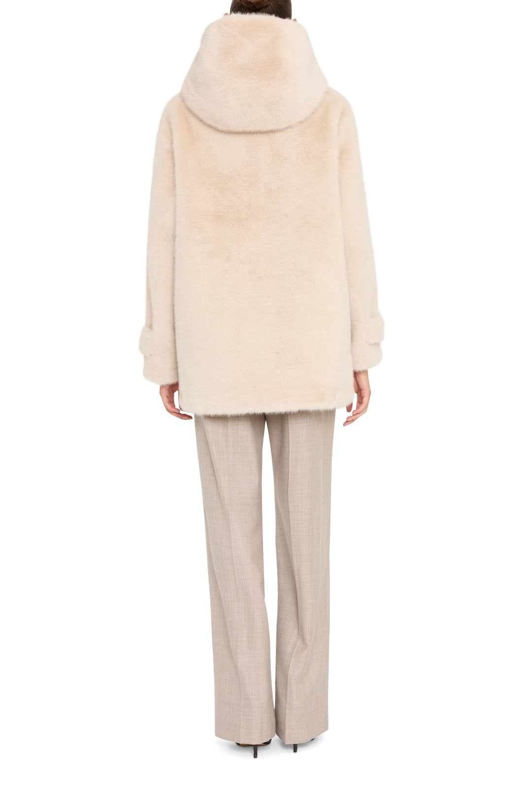 Faux fur coat with relaxed, straight silhouette and long sleeves. Back view on model.
