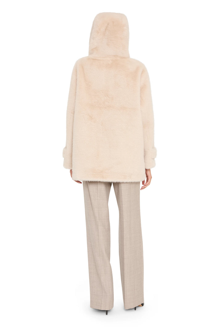 Oversized, hooded silhouette in luxe faux fur with plush texture and clean lines; back view on white.
