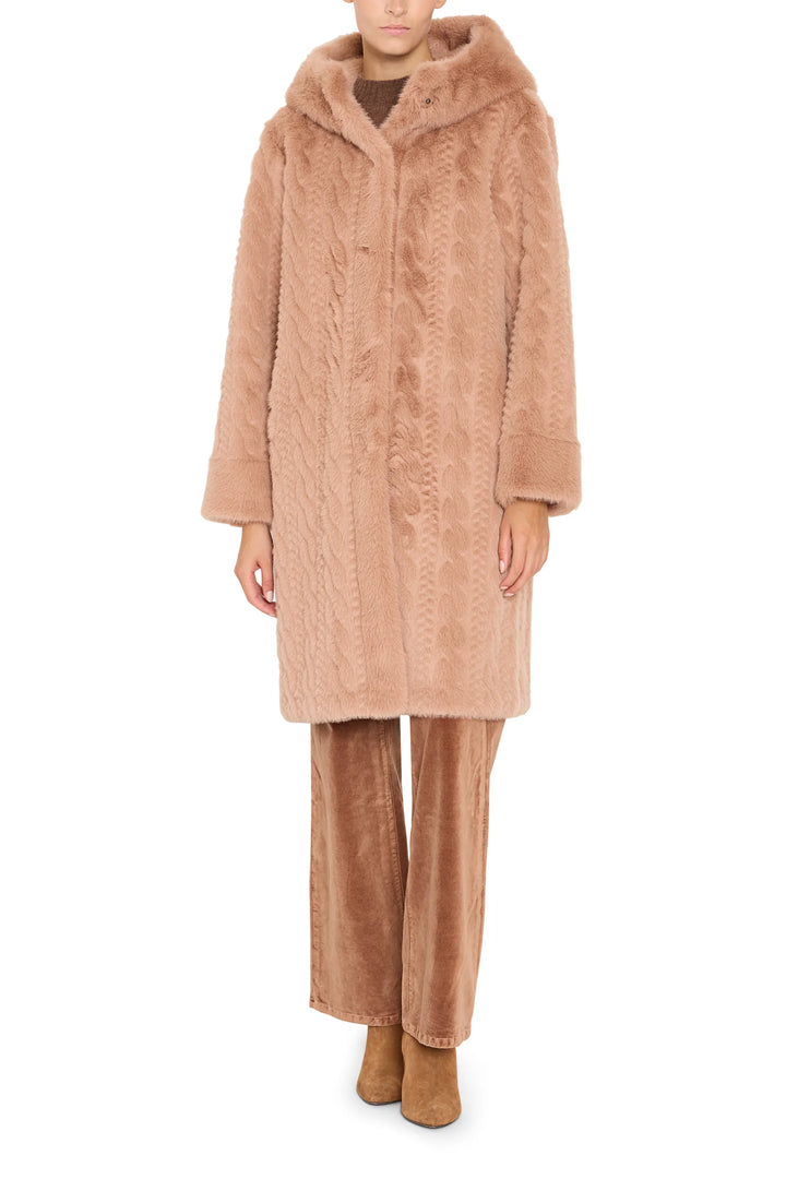 Faux fur coat with cable texture, relaxed silhouette, front closure; front view on model.