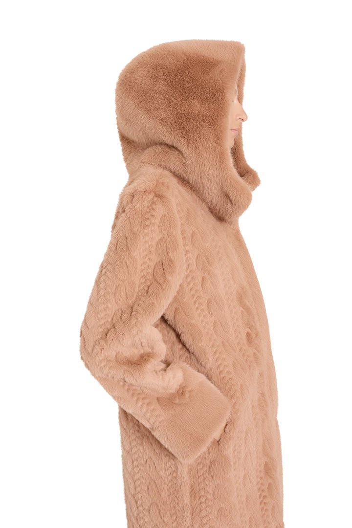 Faux fur coat with oversized hood, relaxed silhouette, cable texture. Side view on model.