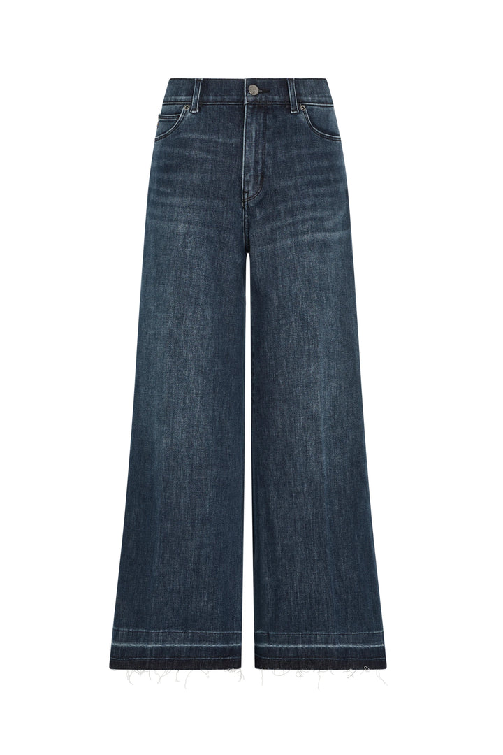 Cropped flare silhouette jean in denim with raw-edge hem, front button, and pockets. Front view on white.