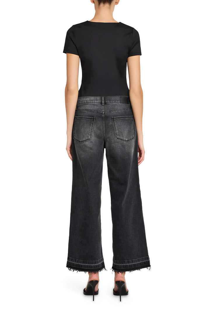 Cropped flare jeans with structured waist, classic five-pocket design, in denim. Back view on model.