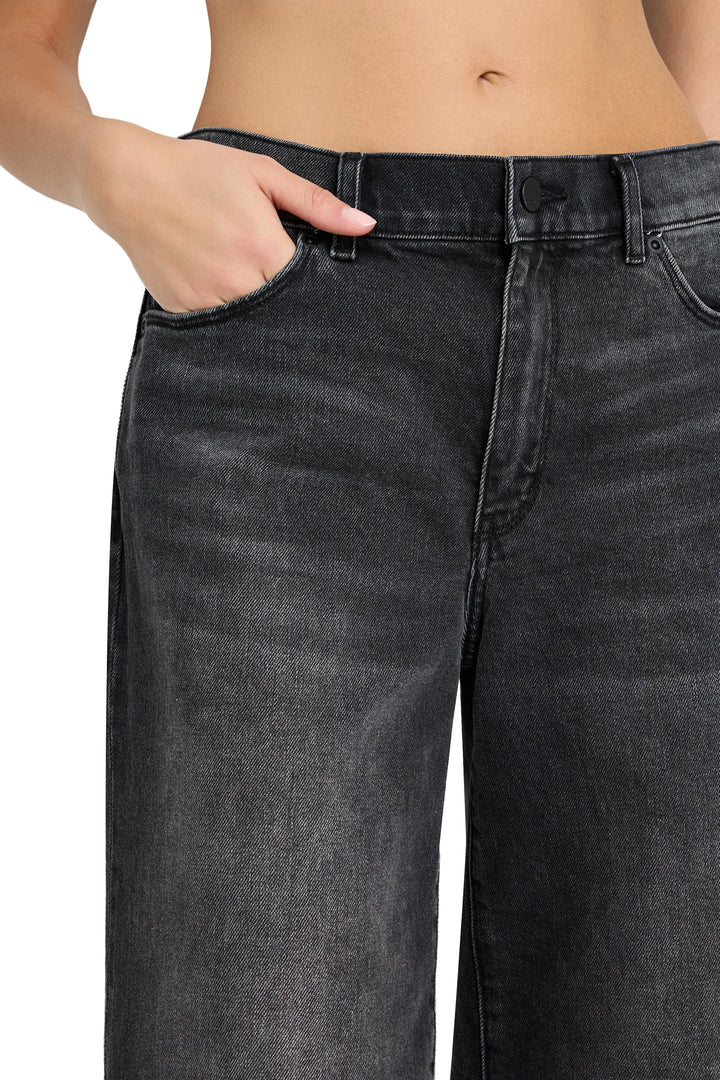 High-waisted cropped flare jean with raw-edge hem, fitted through hip and thigh. Front view on model.