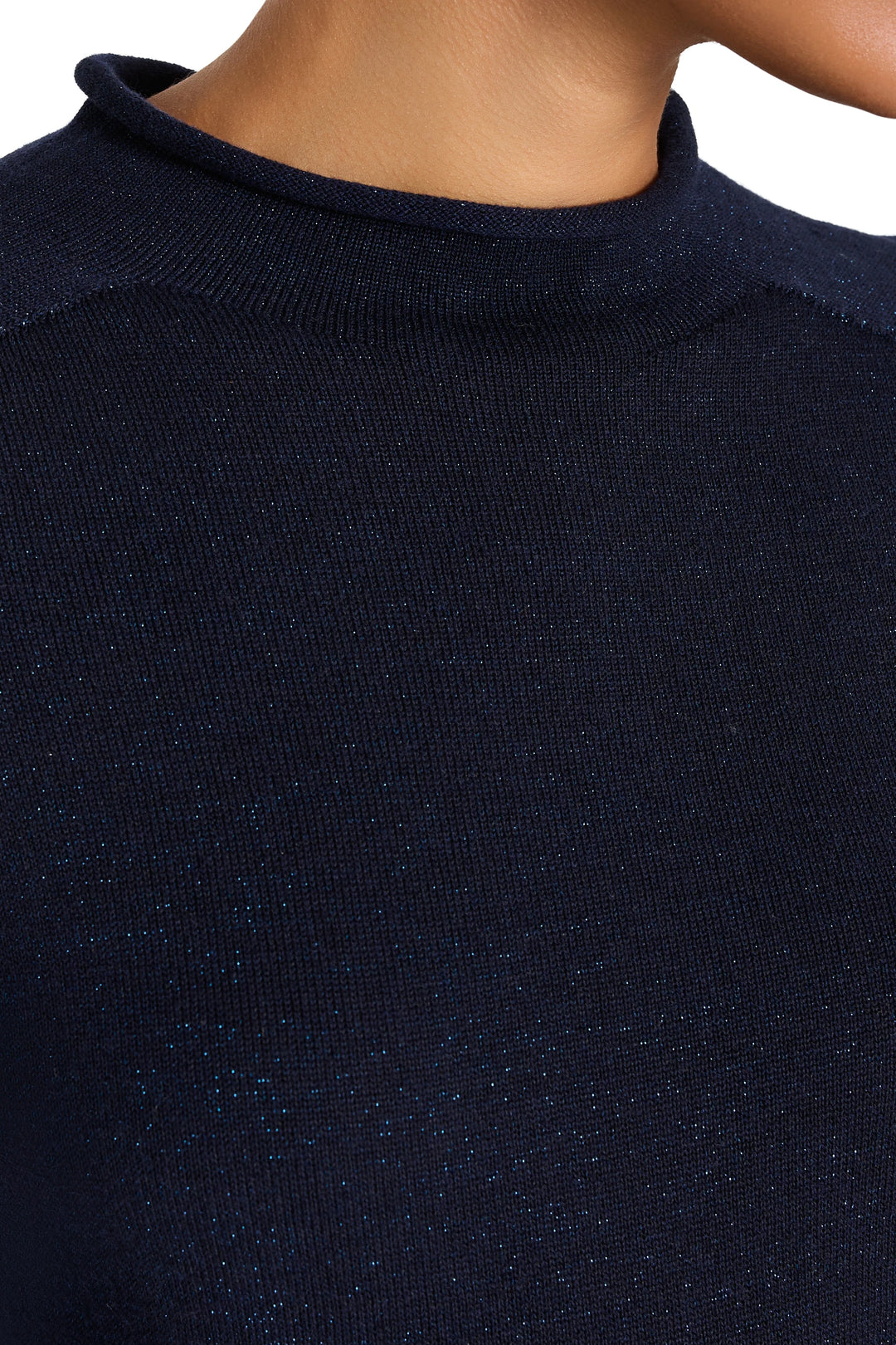 Ribbed lurex knit with subtle shimmer, mock neck construction. Detail view.