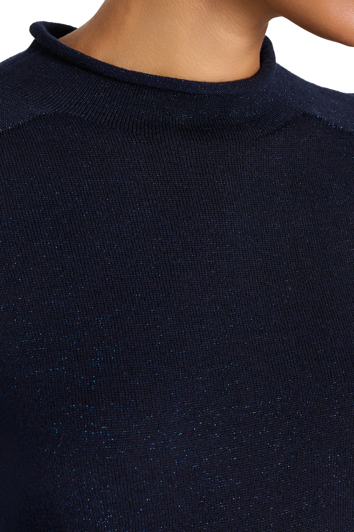 Ribbed lurex knit with subtle shimmer, mock neck construction. Detail view.