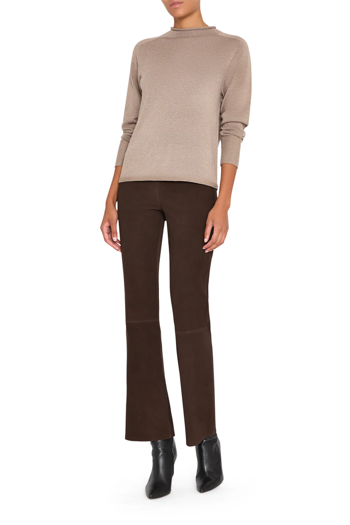 Mock neck sweater with relaxed silhouette, ribbed edges, and fine knit; front view on white.