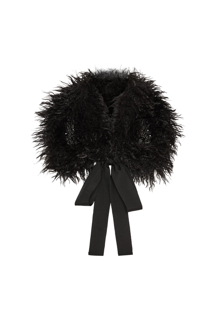 Faux fur collar with jewelry embellishments and black ribbon ties, plush construction, front view on white.