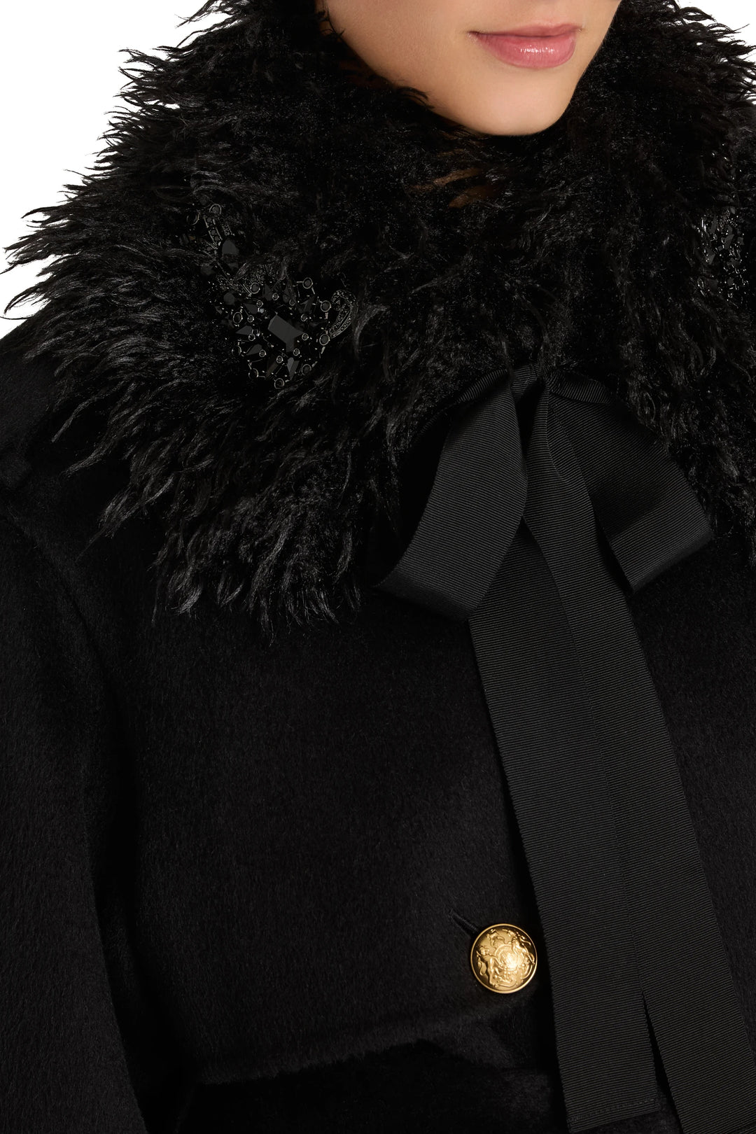 Ashley Embellished Faux Fur Collar with gold button, jewelry-inspired detail; curved silhouette, front view on model.