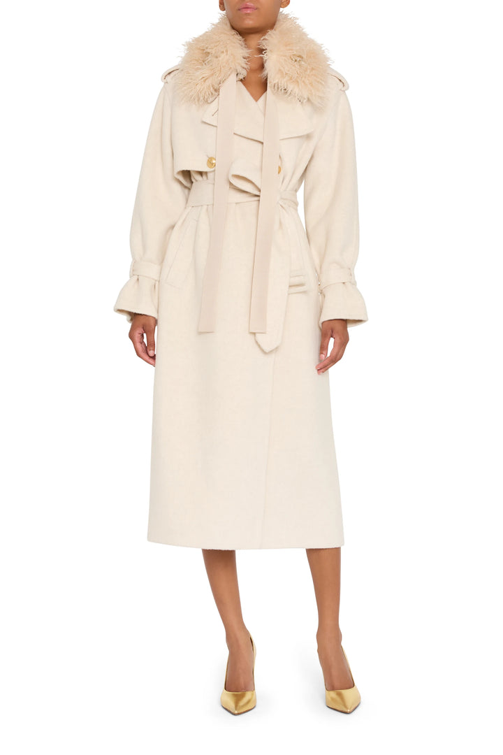 Embellished faux fur collar with jewelry-inspired detailing, structured silhouette; front view on model.