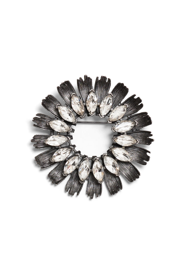 Oval brooch with silver-tone finish, sunflower-inspired floral design, clear marquise crystals, front view on white.