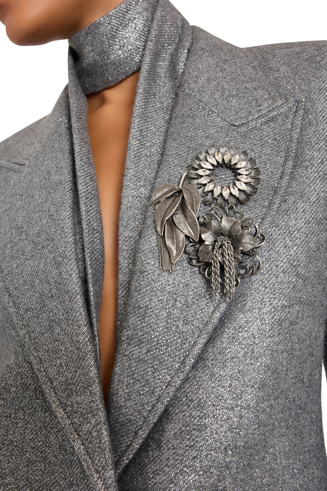 Shimmering blazer with structured silhouette, single-breasted front, and tailored lapels. Front view on model.