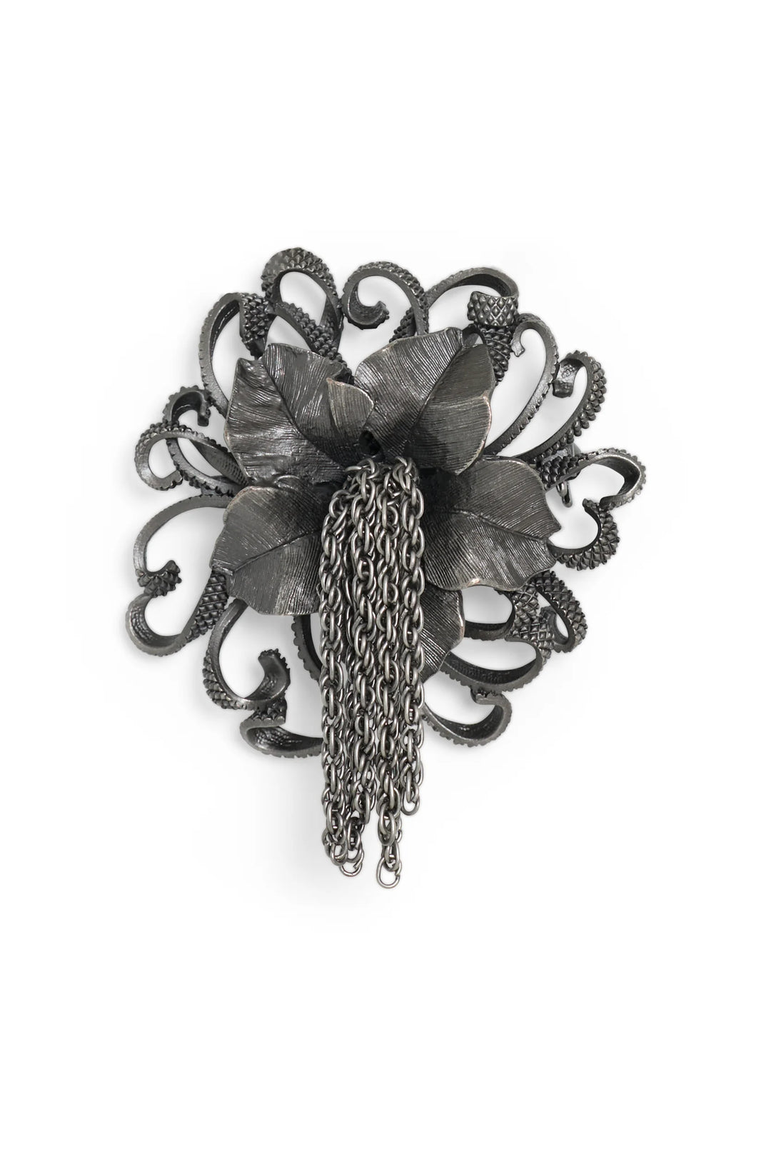 Antique silver brooch with 3D flower petals, ornate tendrils, chain fringe; intricate metalwork. Front view on white.