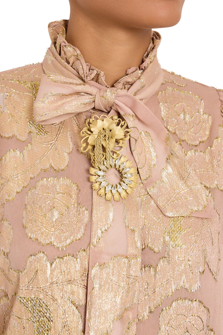Elisa Brooch with chain fringe, intricate metalwork and sleek clasp detail, front view on model.