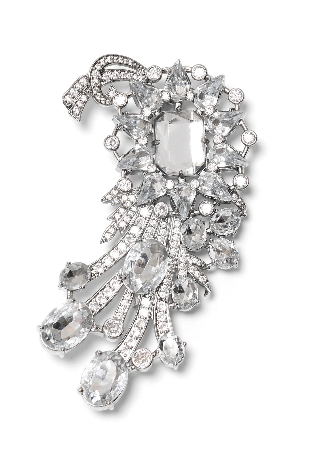 Silver brooch with starburst center, jewel trails, sculptural bow; faceted gems add embellishment. Front view on white.