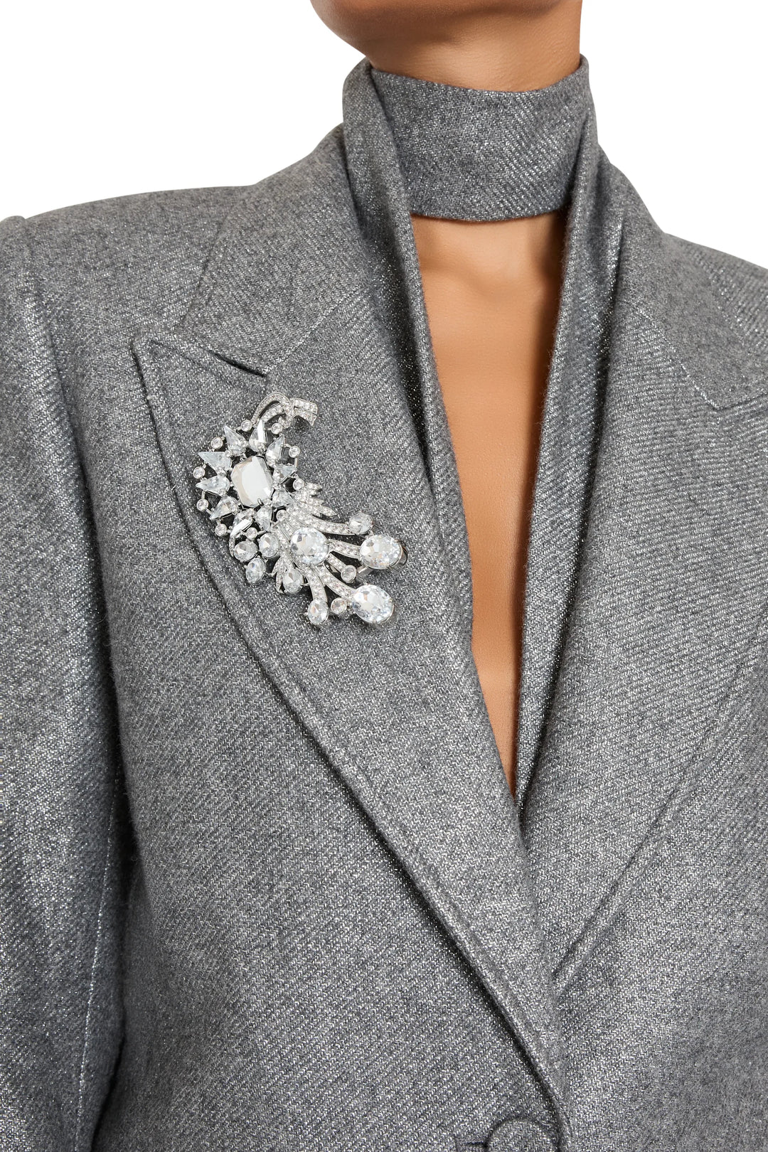 Sculptural Claude Brooch with smooth, fluid curves and polished surface. Front view on model.