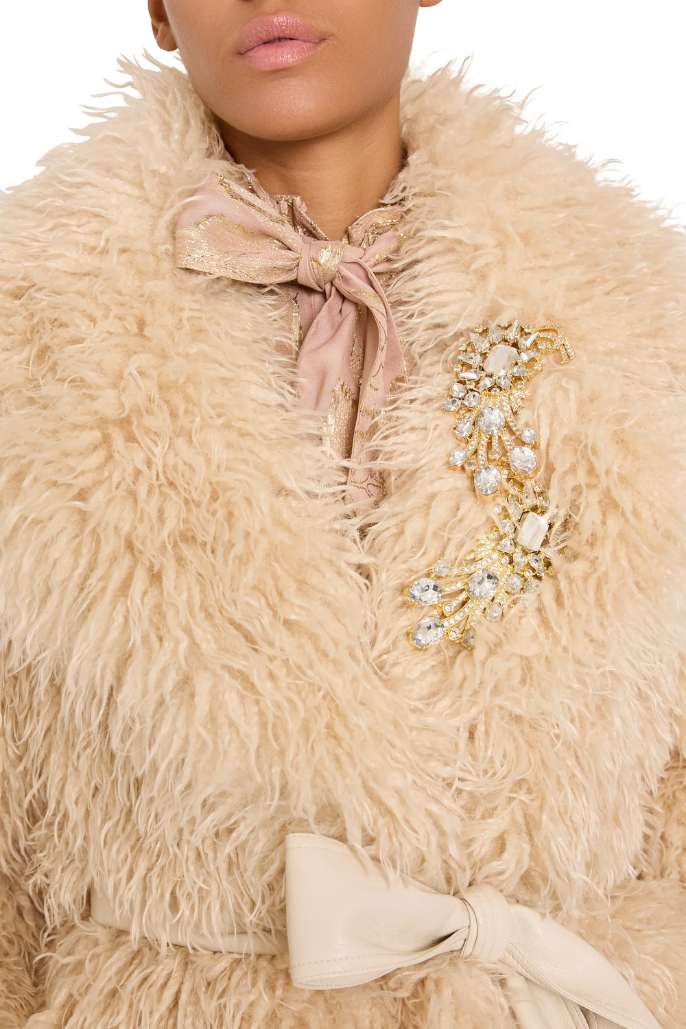 Faux fur coat with voluminous silhouette and plush texture, hook front, sculptural collar; front view on model.