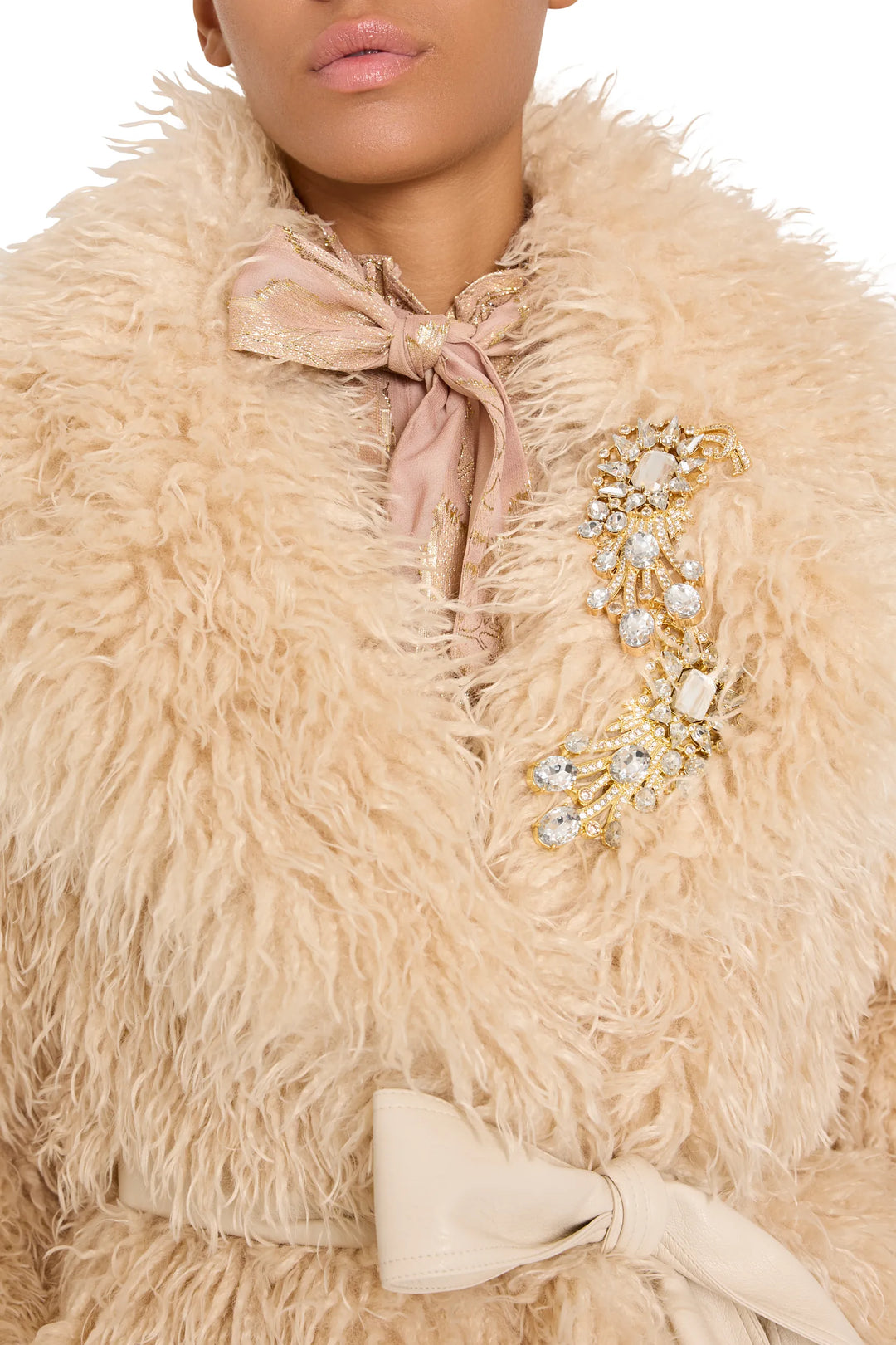 Faux fur coat with voluminous silhouette and plush texture, hook front, sculptural collar; front view on model.