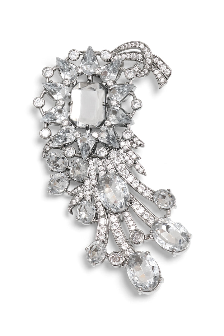 Helen Brooch: Sculptural silver brooch with oval and round stones in cascading rows, front view on white.