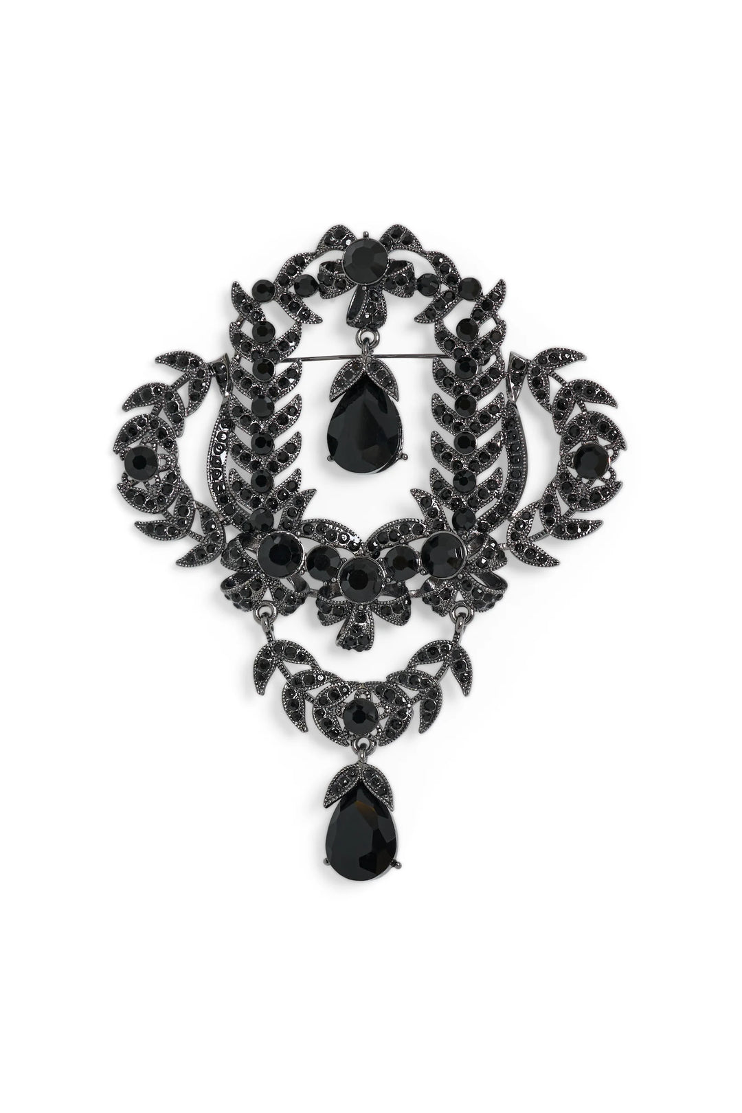 Heirloom-inspired brooch with black gemstone, filigree edges, and crystal teardrop pendant. Front view on white.