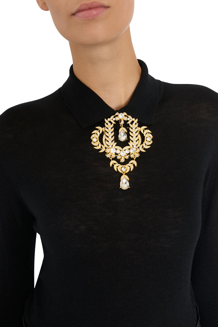 Jasmin Brooch with gold and suspended crystal accents, detailed embellishment. Front view on white.