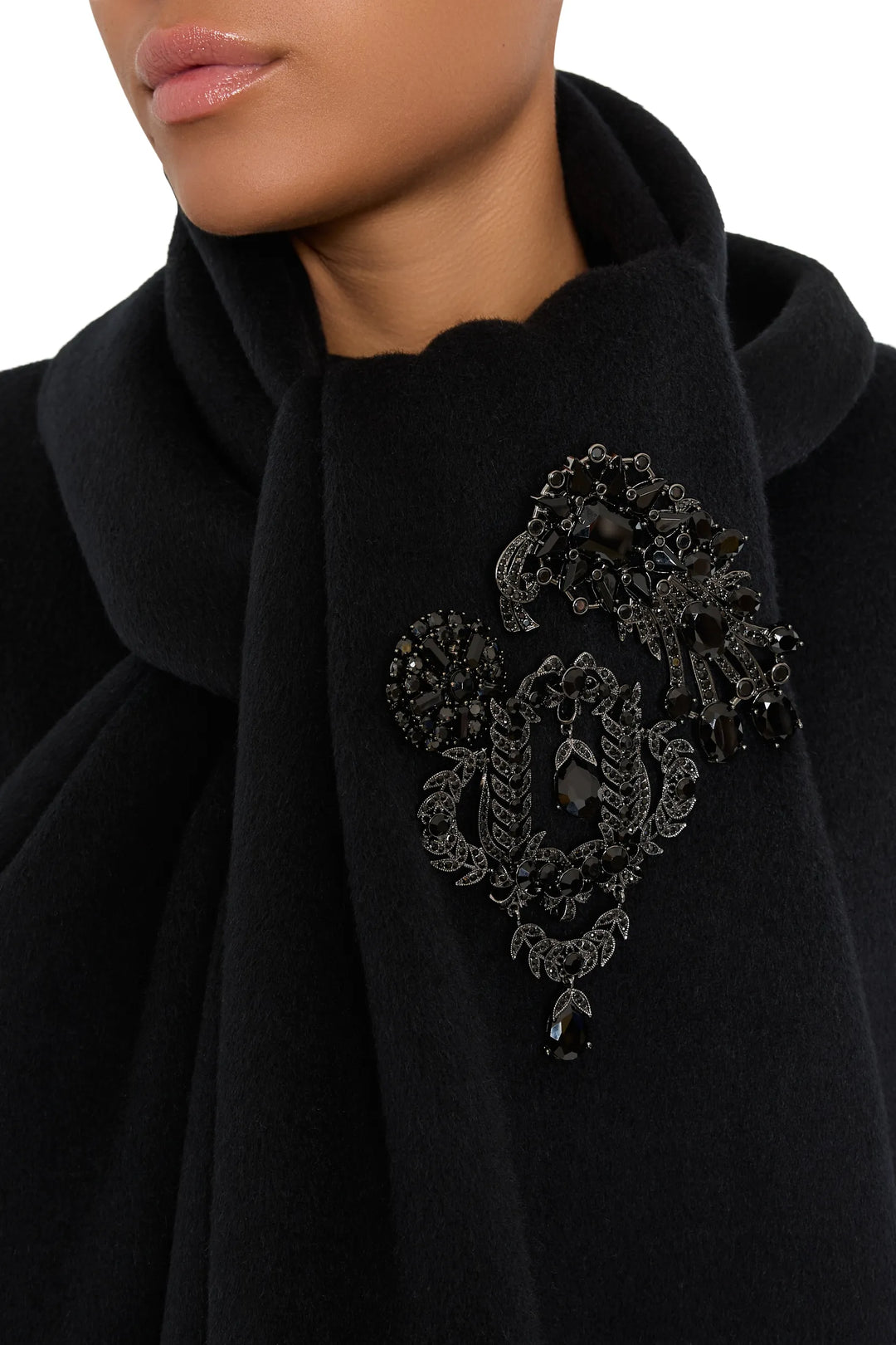 Olga Brooches, vintage-inspired with ornate detailing and polished finish, oval silhouette, front view on model.