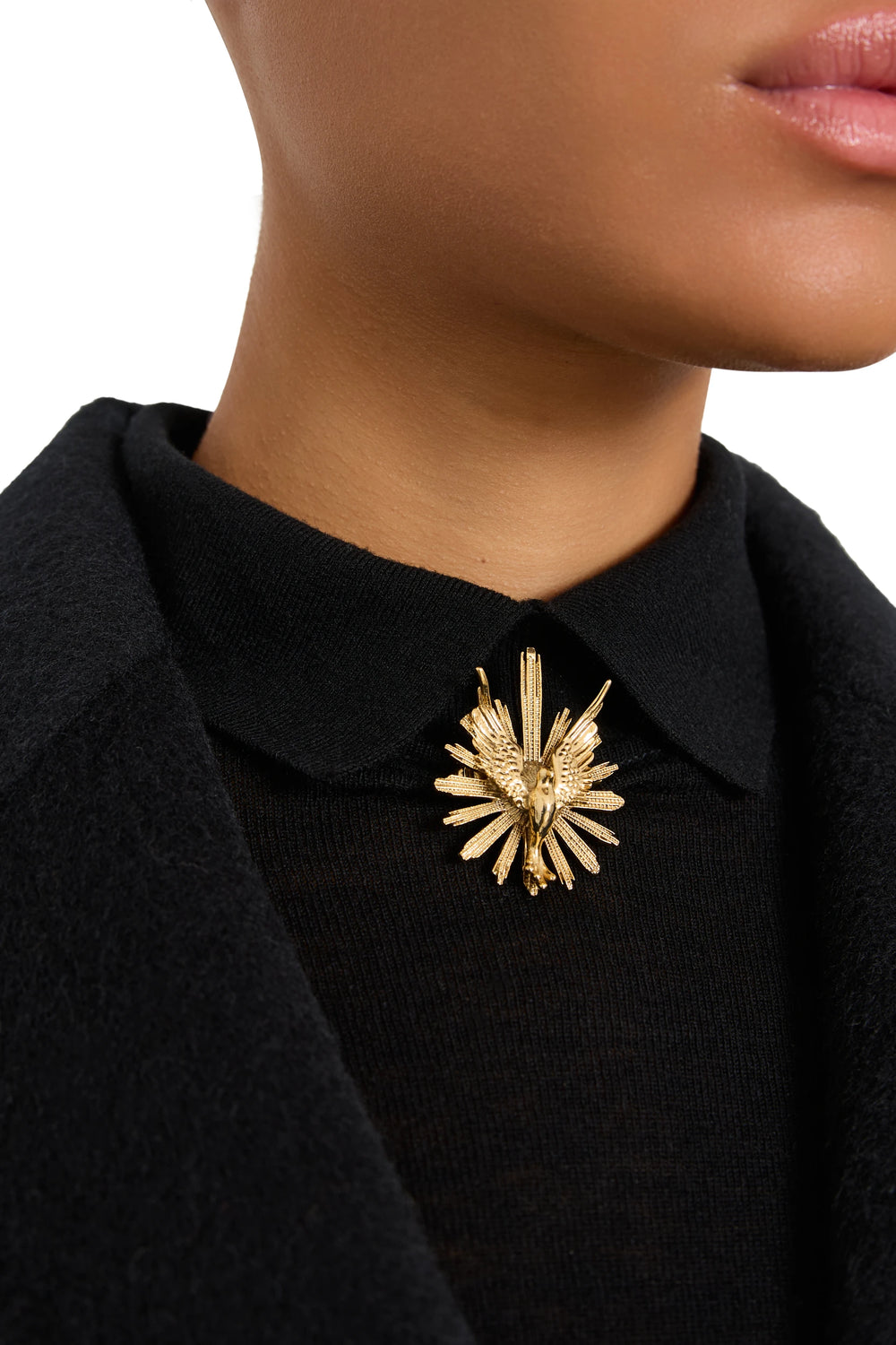 Theresa Round Brooch with polished metal finish and circular silhouette, pin closure; detail view.