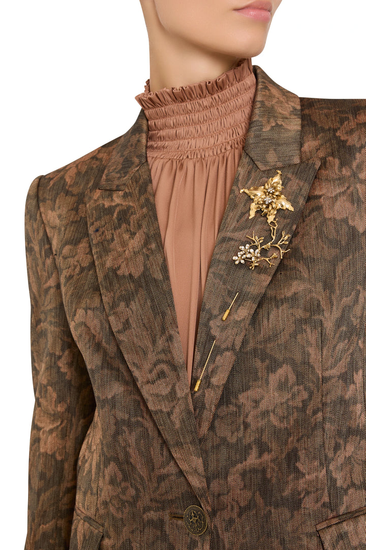 Long tailored blazer with notched lapel, structured silhouette, allover floral embellishment; front view on model.