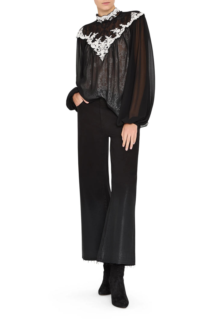 Sheer blouse with hand-embroidered lace, relaxed fit, pintucked detail, and scalloped edges; front view on white.