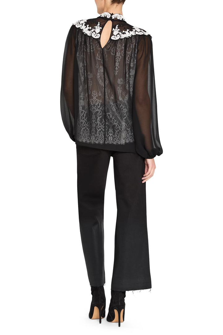 Sheer blouse with embroidered lace, floral collar, long sleeves; relaxed fit. Back view on model.