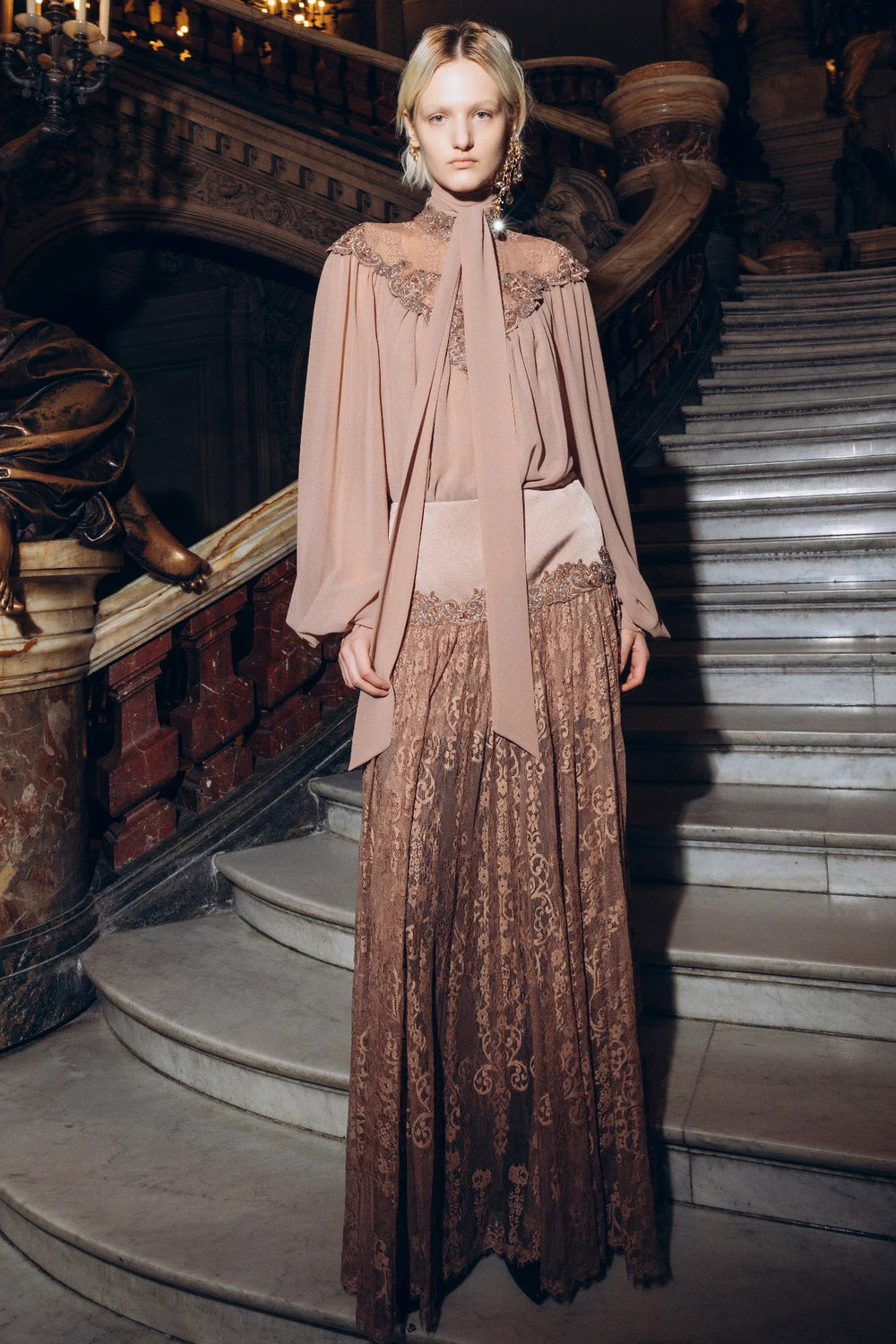 Brown Yvonne Long Lace Skirt with flared silhouette and lace details, front view on model.